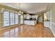 Eat-in kitchen with stainless appliances, granite countertops, and eat-in breakfast nook with large windows at 2382 Merrymount Dr, Suwanee, GA 30024