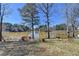 Beautiful lake view from the backyard, showcasing the property's serene waterfront setting at 2382 Merrymount Dr, Suwanee, GA 30024