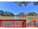 Serene lake view from the backyard deck, highlighting the property's waterfront access and natural beauty at 2382 Merrymount Dr, Suwanee, GA 30024