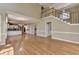 Spacious living room features hardwood floors and a staircase to the second story at 2382 Merrymount Dr, Suwanee, GA 30024