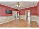 Hardwood floors and open entry ways make this a wonderful and expansive living room at 2382 Merrymount Dr, Suwanee, GA 30024