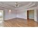 Large main bedroom features hardwood floors, tray ceiling, and access to a bathroom and a walk-in closet at 2382 Merrymount Dr, Suwanee, GA 30024