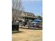A community playground with a clubhouse in the background for residents to enjoy at 2382 Merrymount Dr, Suwanee, GA 30024