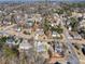 An aerial view of a quiet neighborhood with mature trees and well-maintained lawns at 3176 Crestmont Nw Way, Kennesaw, GA 30152