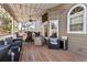 Cozy back deck with outdoor furniture, ceiling fan, lights, and an awning at 3176 Crestmont Nw Way, Kennesaw, GA 30152
