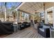 Back deck with outdoor seating, ceiling fan, overhead lighting, and a grill at 3176 Crestmont Nw Way, Kennesaw, GA 30152