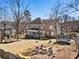 Spacious backyard featuring a fire pit, playhouse, trampoline and covered patio at 3176 Crestmont Nw Way, Kennesaw, GA 30152