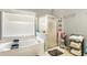 Bright bathroom featuring a soaking tub and separate shower with tile floors, a large window, and modern fixtures at 3176 Crestmont Nw Way, Kennesaw, GA 30152