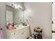 Bright bathroom with a sleek white vanity, a large mirror, and stylish lighting and decor throughout at 3176 Crestmont Nw Way, Kennesaw, GA 30152