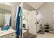 Well-lit bathroom with a connecting door to a carpeted room with a fireplace, featuring modern fixtures and decor at 3176 Crestmont Nw Way, Kennesaw, GA 30152