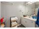 Clean bathroom with a sleek white vanity, a large mirror, and a convenient towel rack with a nice neutral wall color at 3176 Crestmont Nw Way, Kennesaw, GA 30152