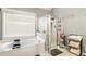 Well-lit bathroom features a combination tub and shower with a large window for natural light at 3176 Crestmont Nw Way, Kennesaw, GA 30152