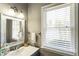 Bathroom with a window and a vanity and sink at 3176 Crestmont Nw Way, Kennesaw, GA 30152