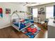 bedroom featuring hardwood floors, ceiling fan, Spiderman rug, and a unique house frame bed at 3176 Crestmont Nw Way, Kennesaw, GA 30152
