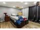 Cluttered basement bedroom featuring hardwood floors, a bed, and a dresser at 3176 Crestmont Nw Way, Kennesaw, GA 30152