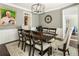 Dining room with seating for six, decorative clock, and an open doorway at 3176 Crestmont Nw Way, Kennesaw, GA 30152