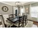 Dining room featuring a dark wood table, seating for six, and elegant chandelier at 3176 Crestmont Nw Way, Kennesaw, GA 30152