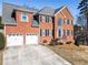 Stylish red brick home with a two-car garage and picturesque front yard at 3176 Crestmont Nw Way, Kennesaw, GA 30152