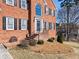 Charming brick home with a covered front porch and meticulously landscaped yard at 3176 Crestmont Nw Way, Kennesaw, GA 30152