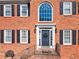 Inviting front entrance of a well-maintained red brick home with a beautiful entry door at 3176 Crestmont Nw Way, Kennesaw, GA 30152