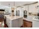 Bright kitchen with stainless steel appliances, granite countertops, and an island that has pendant lighting at 3176 Crestmont Nw Way, Kennesaw, GA 30152