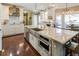 Well-appointed kitchen featuring stainless steel appliances, modern countertops, and a breakfast bar at 3176 Crestmont Nw Way, Kennesaw, GA 30152