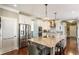Spacious kitchen featuring a large island, granite countertops, and stainless steel appliances at 3176 Crestmont Nw Way, Kennesaw, GA 30152