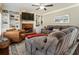Inviting living room with a brick fireplace, built-in bookshelves, and comfortable seating at 3176 Crestmont Nw Way, Kennesaw, GA 30152