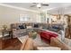 Inviting living room with a comfortable sectional sofa and view into the modern kitchen at 3176 Crestmont Nw Way, Kennesaw, GA 30152