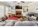 Bright living room with fireplace, built-in shelving, and large, comfortable seating at 3176 Crestmont Nw Way, Kennesaw, GA 30152