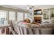 Comfortable living room featuring built-in shelves, a brick fireplace, and lots of natural light at 3176 Crestmont Nw Way, Kennesaw, GA 30152