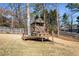 Outdoor playset with a covered area and wooden platform, perfect for ' activities in the backyard at 3176 Crestmont Nw Way, Kennesaw, GA 30152