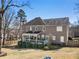 Rear view of the house, showcasing the covered porch and well-maintained landscaping at 3176 Crestmont Nw Way, Kennesaw, GA 30152