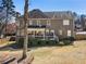 Two-story home featuring a covered porch, neat landscaping, and a spacious backyard at 3176 Crestmont Nw Way, Kennesaw, GA 30152