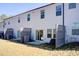 View of the back exterior featuring fenced patios at 5652 Plain Field Ln, Lilburn, GA 30047