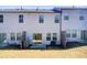 Back exterior with sliding doors, windows and fenced patios at 5652 Plain Field Ln, Lilburn, GA 30047