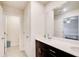 Modern bathroom with a double sink vanity and large mirror at 5652 Plain Field Ln, Lilburn, GA 30047