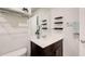 Small bathroom featuring a single sink vanity, large mirror and towel rack at 5652 Plain Field Ln, Lilburn, GA 30047