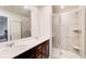 Bathroom with double sink vanity and glass enclosed walk-in shower at 5652 Plain Field Ln, Lilburn, GA 30047