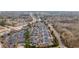 An aerial shot shows a well-planned community with tree-lined streets and various housing options near local roads at 10104 Windrush Ln, Alpharetta, GA 30009