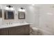 Bathroom featuring double sinks and a shower/bathtub combination at 10104 Windrush Ln, Alpharetta, GA 30009