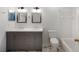 Bathroom featuring double sinks and a shower/bathtub combination at 10104 Windrush Ln, Alpharetta, GA 30009