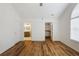 Bedroom featuring wood floors and an ensuite bathroom and closet at 10104 Windrush Ln, Alpharetta, GA 30009