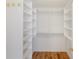 Walk-in closet featuring built in shelves at 10104 Windrush Ln, Alpharetta, GA 30009