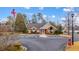 Clubhouse featuring a brick facade and well maintained landscaping at 10104 Windrush Ln, Alpharetta, GA 30009