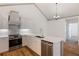 Modern kitchen features stainless steel appliances, white cabinets, quartz counters, and a decorative backsplash at 10104 Windrush Ln, Alpharetta, GA 30009