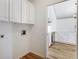 Eat-in kitchen featuring stainless steel appliances and white cabinets at 10104 Windrush Ln, Alpharetta, GA 30009