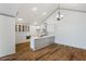 Bright kitchen with white cabinets, quartz countertops, stainless steel appliances, and modern fixtures at 10104 Windrush Ln, Alpharetta, GA 30009