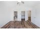 Bright main bedroom features vaulted ceiling, wood look floors and ensuite bath and walk-in closet at 10104 Windrush Ln, Alpharetta, GA 30009