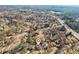 Aerial view of a residential neighborhood featuring mature trees and convenient access to the highway at 10475 Willow Meadow Cir, Alpharetta, GA 30022